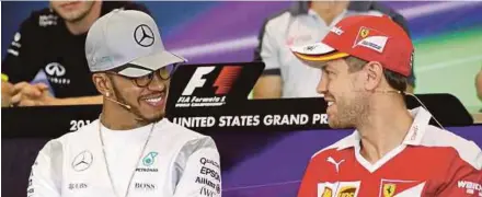  ??  ?? Lewis Hamilton
Sebastian Vettel
APpic