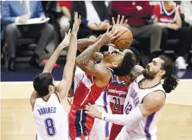  ?? AP FOTO ?? BLOCKED. Washington Wizards forward Kelly Oubre Jr, fails to get past a double team from the Thunder.