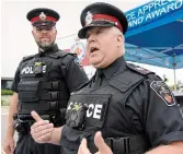  ?? JASON LIEBREGTS TORSTAR FILE PHOTO ?? In this 2018 photo, Durham Regional Police highlight the benefits of body-worm camera technology. Kojo Damptey argues they wouldn’t prevent police violence against civilians and are not a good investment.