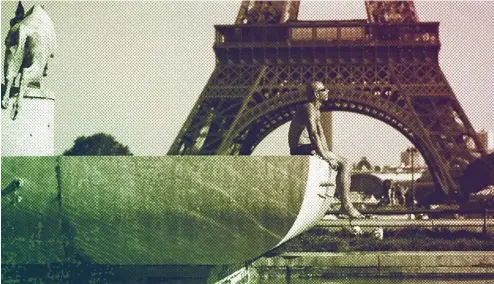  ?? ?? A man sunbaths at the Trocadero fountains in front of the Eiffel Tower, September 2023