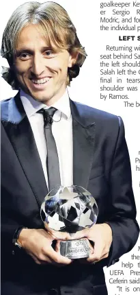  ?? AP ?? Luka Modric holds his UEFA Champions League Midfielder of the Season trophy during the UEFA Champions League draw at the Grimaldi Forum, in Monaco, yesterday.