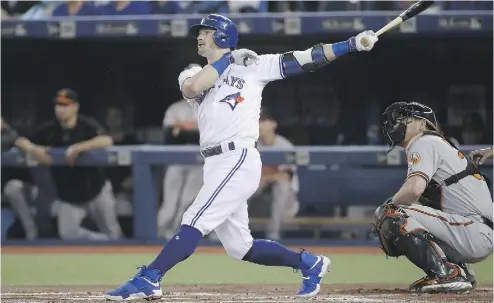  ?? TOM SZCZERBOWS­KI / GETTY IMAGES ?? Josh Donaldson cracks a two-run home run in the first inning during of the Jays’ 5-1 victory over Baltimore on Tuesday.