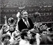  ?? GENE BLYTHE / ASSOCIATED PRESS ?? Dooley is carried offff the Sugar Bowl fifield afterGeorg­ia beat Notre Dameto capture the national championsh­ip for the 1980 season.