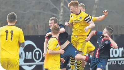  ??  ?? Stuart Soane heads in the winner for Forres Mechanics