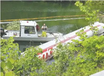  ?? CONTRIBUTE­D PHOTOS VIA POLK COUNTY SHERIFF’S OFFICE ?? A semitracto­r-trailer rests in the waters of the Ocoee River after an accident.