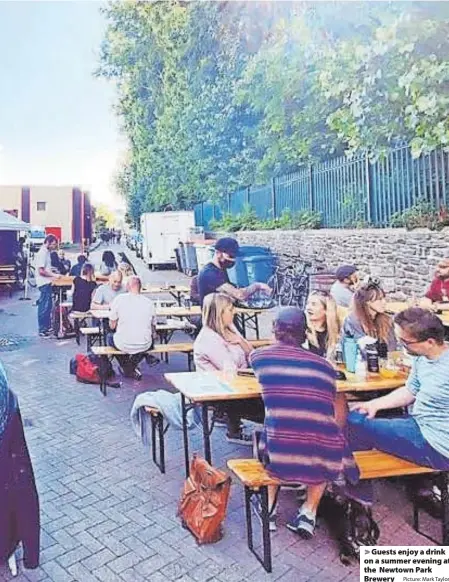  ?? Picture: Mark Taylor ?? > Guests enjoy a drink on a summer evening at the Newtown Park Brewery