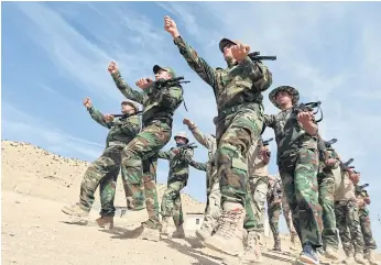  ??  ?? ALLIANCE: Christian volunteers, who have joined the Kurdish Peshmerga fighters, take part in training at a base in the town of Alqosh in Iraq this month.