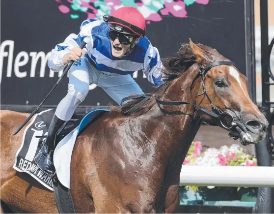  ?? Picture: AAP IMAGE ?? Regan Bayliss celebrates winning the Group 1 Newmarket Handicap on Redkirk Warrior at Flemington in the autumn.