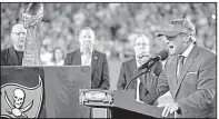  ?? AP/PHELAN M. EBENHACK ?? Former Tampa Bay Buccaneers head coach Jon Gruden addresses fans as he is inducted into the Buccaneers Ring of Honor during halftime of the Dec. 18 game against the Atlanta Falcons in Tampa, Fla.