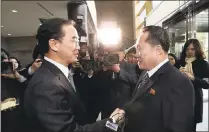  ?? KOREA POOL/ YONHAP VIA AP ?? South Korean Unificatio­n Minister Cho Myoung-gyon, left, greets the head of the North Korean delegation, Ri Son Gwon, before their meeting in the Demilitari­zed Zone in Paju, South Korea, today.