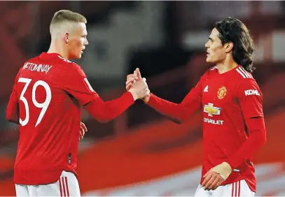  ?? Picture: Reuters ?? WINNING FEELING. Manchester United’s goalscorer Scott McTominay (left) congratula­tes team-mate Edinson Cavani after they beat West Ham United 1-0 in the fifth round of the FA Cup at Old Trafford.