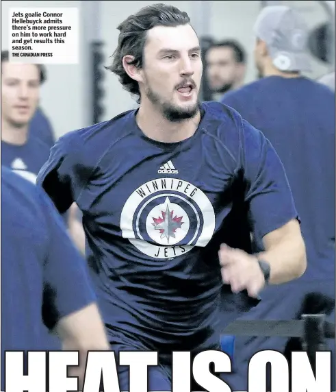  ?? THE CANADIAN PRESS ?? Jets goalie Connor Hellebuyck admits there’s more pressure on him to work hard and get results this season.