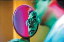  ?? Korea Times photo by Shim Hyun-chul ?? Plastic surgeon-novelist Kim You-myung is seen in a mirror in the award-winning photo, “The Man in the Mirror,” taken by Korea Times photograph­er Shim Hyun-chul on May 7.