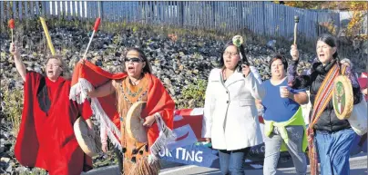  ?? NIKKI SULLIVAN/CAPE BRETON POST ?? About 50 people walked from the site of the original Membertou reserve on Sunday during the opening ceremonies for the national inquiry into missing and murdered Indigenous women and girls, which begins in Membertou today.