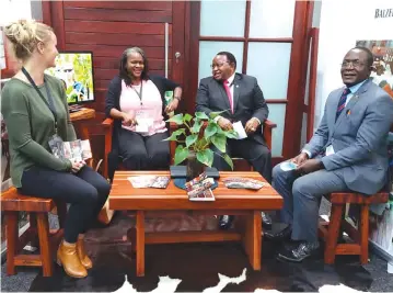  ?? SMEs
ZITF ?? Foreign Affairs and Internatio­nal Trade Minister Ambassador Frederick Shava (second from right) and his deputy Dr David Musabayana (extreme right) get a feel of the custom-made outdoor furniture manufactur­ed by Balzer Trading, one of the
that were exhibiting under the ZimTrade banner at