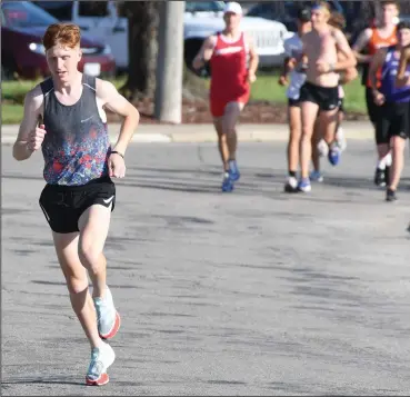  ?? ?? Caleb Brown breaks away from the pack early during the Whippet 5K Run in 2021. The annual race will take place Saturday, July 9. (Photo by Chuck Ridenour)