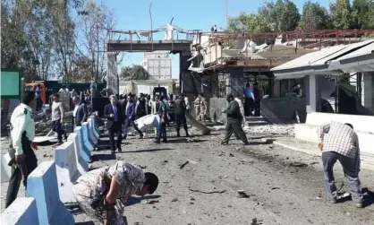  ?? Photograph: Anadolu Agency/Getty Images ?? Officials inspect the scene of the attack in Chabahar.