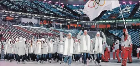  ?? ASSOCIATED PRESS FILE PHOTO ?? Athletes from Russia react during the opening ceremony of the 2018 Winter Olympics in Pyeongchan­g, South Korea.