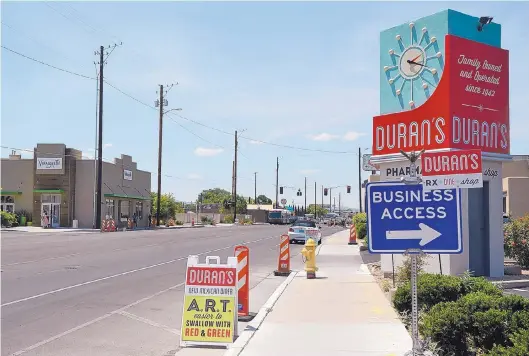  ?? JIM THOMPSON/JOURNAL ?? Duran’s Central Pharmacy and Vinaigrett­e restaurant are among around 20 businesses along the section of Central between 10th Street and San Pasquale that have joined together to create a new identity for the area, calling it “West Downtown.”