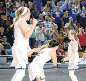  ??  ?? Hollie Wood, right, and her Pryor teammates celebrate their 54-46 win over Woodward in the Class 5A state semifinals Friday in Tulsa.