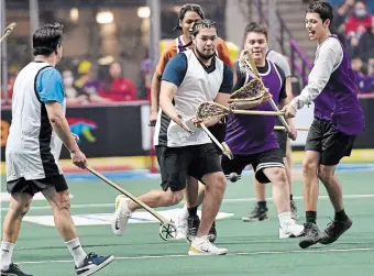  ?? BARRY GRAY THE HAMILTON SPECTATOR FILE PHOTO ?? In last year’s game, Indigenous teams use traditiona­l wooden lacrosse sticks at halftime.