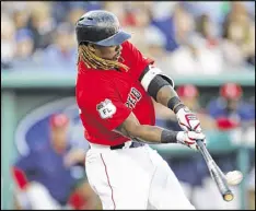  ?? JOEL AUERBACH / GETTY IMAGES ?? Hanley Ramirez of the Red Sox makes contact during Thursday’s Grapefruit League game against the Pirates in Fort Myers, Fla.