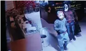  ??  ?? A CCTV footage of the two masked burglars.