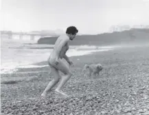  ??  ?? 0 A naked man discovers how cold it is in the water as Brighton’s nudist beach opens on this day in 1980