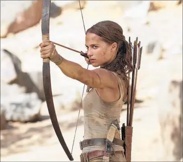  ?? Warner Bros. Entertainm­ent ?? A BOW AND ARROW are taken up by Alicia Vikander in a new telling of the energetic “Tomb Raider.”