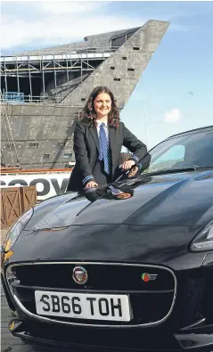  ?? Picture: Dougie Nicolson. ?? Top young designer Luisa Geddes beside a Jaguar F-Type at Discovery Point yesterday.