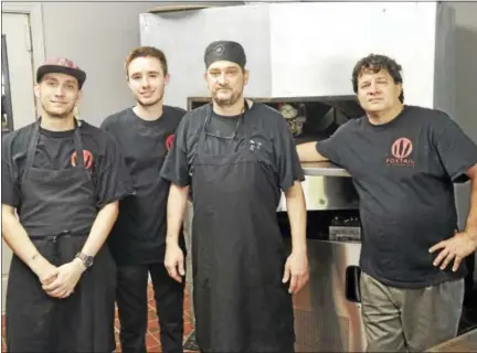  ?? BEN LAMBERT — HEARST CONNECTICU­T MEDIA ?? The staff at Foxtail Fine Catering and Cafe, which recently opened in downtown Winsted, includes chef Jay Plourde, second from right, and Armand Lattizori, right.