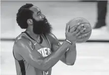  ?? POOL PHOTO VIA USA TODAY SPORTS] ?? Houston guard James Harden led the NBA in scoring for the third consecutiv­e season, averaging 34.3 points per game. [MIKE EHRMANN/