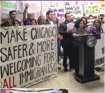  ?? JACOB WITTICH/ SUN- TIMES ?? ABOVE: Aldermen and immigrant rights organizati­ons, at a City Hall rally last year, want an amendment to Chicago’s Welcoming City ordinance to further protect the city’s immigrant community.