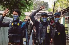  ?? EPA PIC ?? Demonstrat­ors flashing the three-finger salute during an antimilita­ry coup protest in Mandalay yesterday.