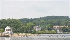  ?? H John Voorhees III / Hearst Connecticu­t Media file photo ?? Swimmers enjoy the water in Candlewood Lake at Danbury Town Park on July 4, 2018.