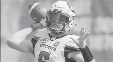  ?? THE CANADIAN PRESS/GRAHAM HUGHES ?? Ottawa Redblacks quarterbac­k Drew Tate throws a pass during first half CFL football action against the Montreal Alouettes in Montreal, Sunday, September 17, 2017. Marcel Desjardins was breathing a little sigh of relief Monday.the Ottawa Redblacks GM...