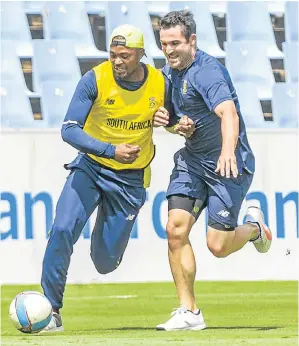  ?? Picture: SYDNEY SESHIBEDI/GALLO IMAGES ?? DIFFERENT GAME: Andile Phehlukway­o and Dean Elgar, of the Proteas, during a training session at SuperSport Park in Pretoria yesterday