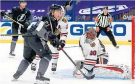  ?? MIKE EHRMANN/GETTY ?? The Lightning’s Brayden Point scores on Blackhawks goalie Malcolm Subban on Saturday in Tampa, Fla. The Lightning won 4-1.