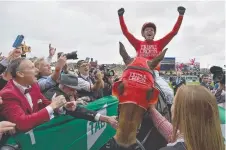  ?? Picture: PETER PARKS ?? Jockey Kerrin McEvoy celebrates on Redzel after winning The Everest at Royal Randwick