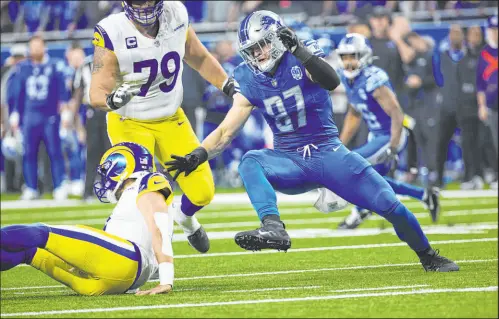  ?? Rick Osentoski The Associated Press ?? Defensive end Aidan Hutchinson and the Detroit Lions have been difficult to run against all season. They host Tampa Bay in the divisional playoffs Sunday.
