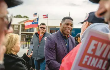  ?? BRANDON BELL/GETTY ?? GOP U.S. Senate candidate Herschel Walker greets supporters Wednesday in McDonough, Georgia.