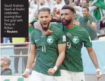  ?? — Reuters ?? Saudi Arabia’s Saleh al Shehri celebrates scoring their first goal with Feras al Brikan.