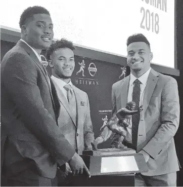  ?? RALPH RUSSO AP ?? Tua Tagovailoa, right and Kyler Murray, center, became acquainted when both were finalists for the Heisman Trophy along with Dwayne Haskins in 2018. Murray won the award.