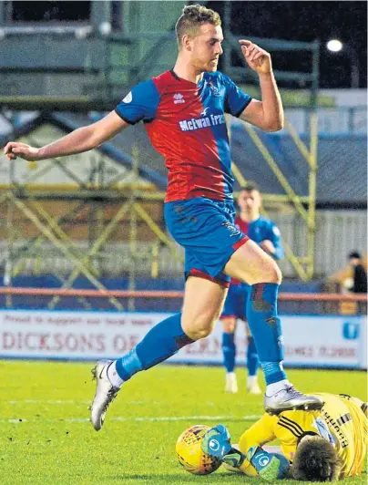  ??  ?? NO PASSAGE: Caley Thistle striker Jordan White is stopped by Ayr United keeper Ross Doohan