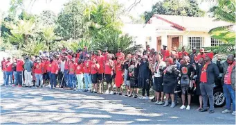  ?? ?? EFF members at the Gardee family residence in Mbombela, Mpumalanga, yesterday following the killing of Hillary Gardee, daughter of the party’s former secretary-general Godrich Gardee.