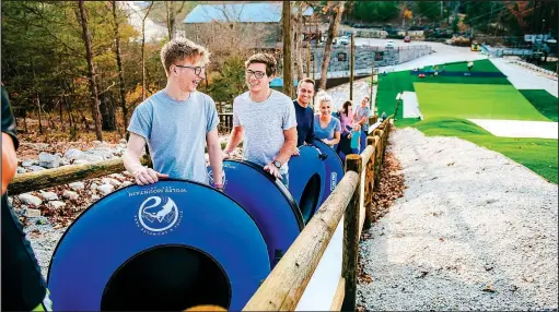  ?? Courtesy Photo ?? A “Magic Carpet” carries riders up the hill so they can tube down it at Snowflex.