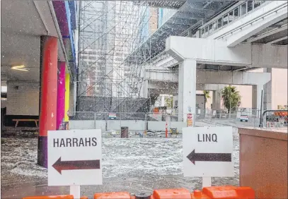  ?? Elizabeth Page Brumley Las Vegas Review-journal @Elipagepho­to ?? Heavy rain causes flooding at The Linq parking garage. The Nevada Highway Patrol responded to 111 crashes Wednesday.