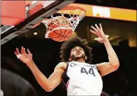  ?? Rick Bowmer / Associated Press ?? UConn’s Andre Jackson Jr. (44) dunks against Iowa State during the Phil Knight Invitation­al championsh­ip on Sunday in Portland, Ore.