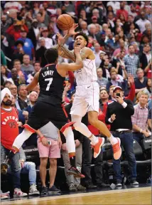  ?? Associated Press photo ?? Washington Wizards forward Kelly Oubre Jr. (12) is fouled by Toronto Raptors guard Kyle Lowry (7) during the second half of Game 4 of an NBA basketball first-round playoff series, Sunday in Washington.