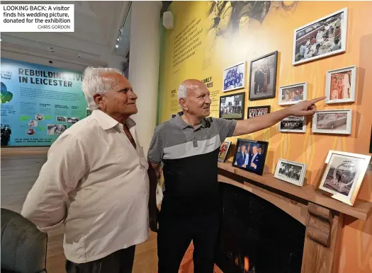  ?? CHRIS GORDON ?? LOOKING BACK: A visitor finds his wedding picture, donated for the exhibition